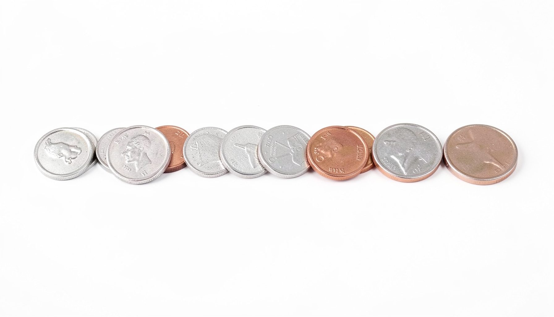 A row of coins increasing in size, minimalist composition on a white background, metallic silver and copper tones
